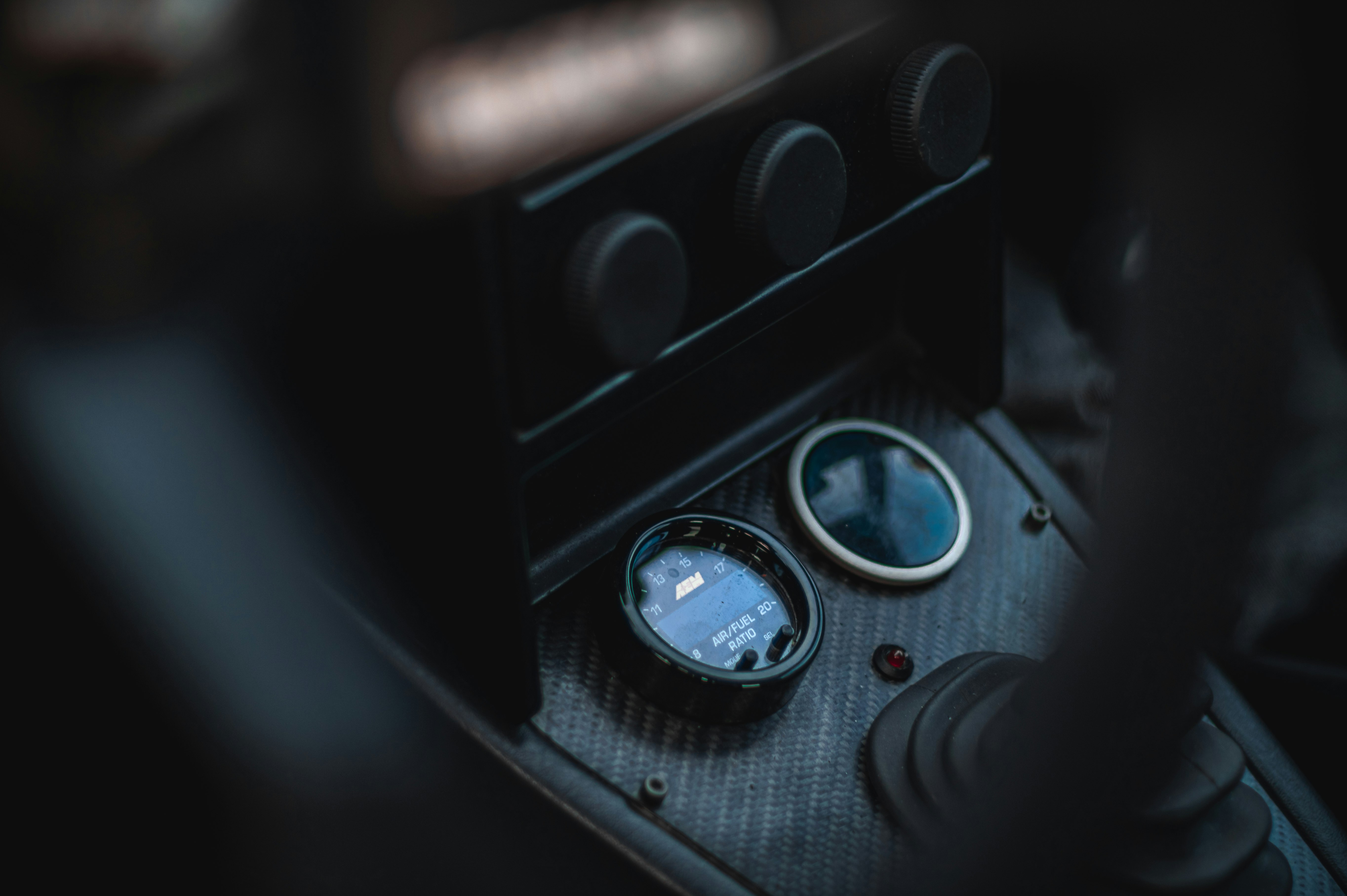 a close up of a car dashboard with a gauge demonstrating vehicle diagnostics AI